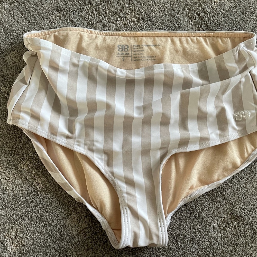 Tan and white Albion swim bottom